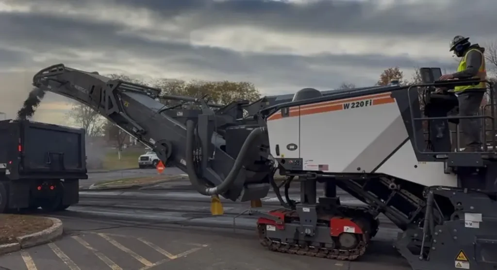 Asphalt being milled from parking lot