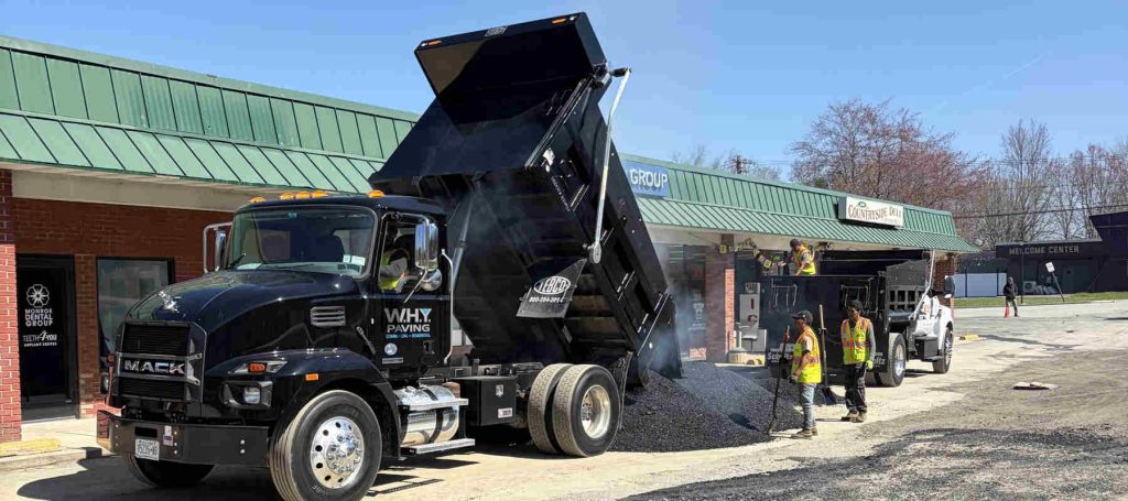 Asphalt being installed in a parking lot