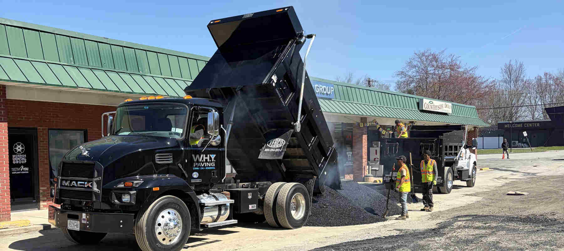 Asphalt being installed in a parking lot